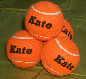  orange tennis balls, personalised by J Price
